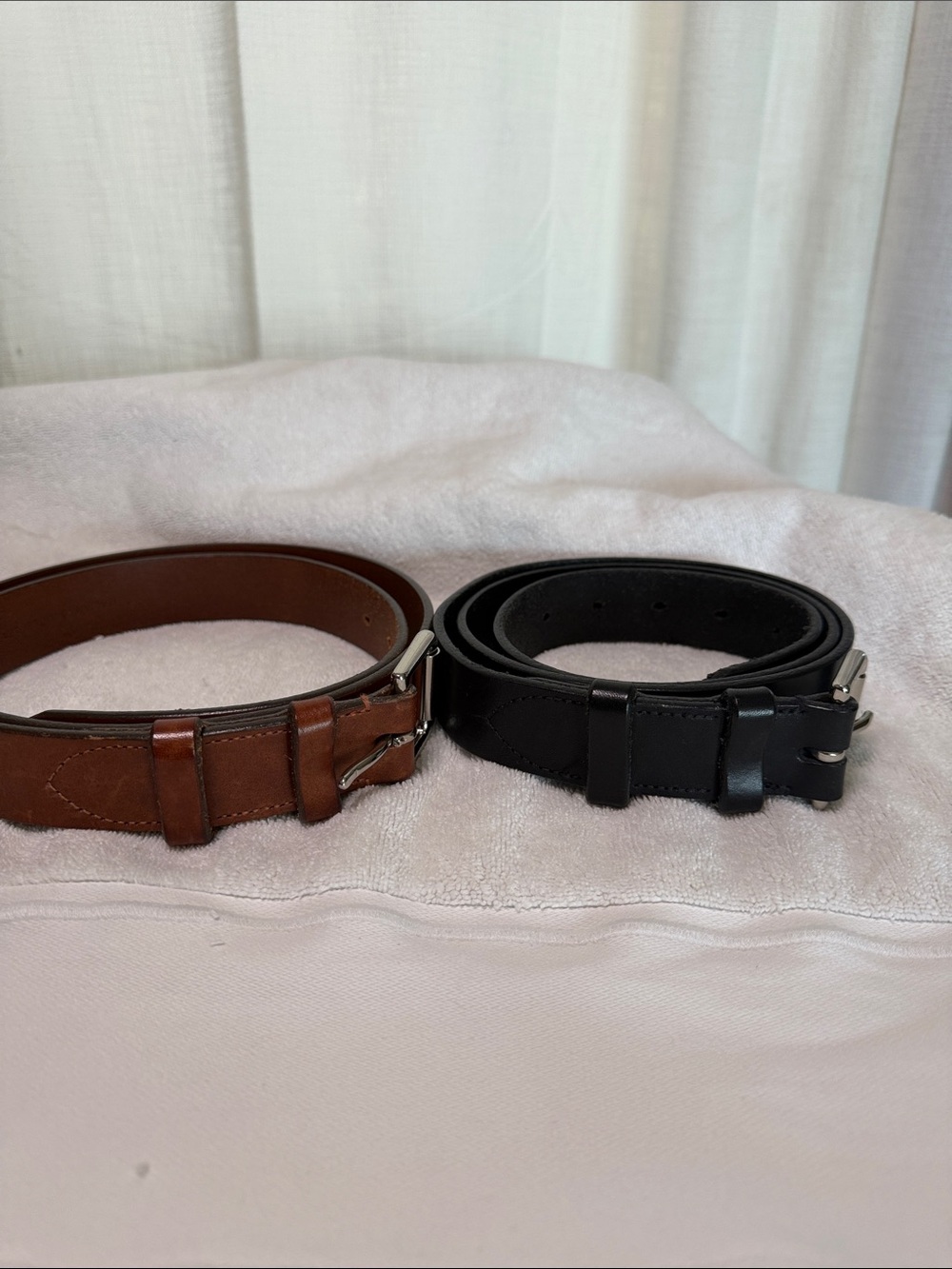 Ralph Lauren belts. One black one brown